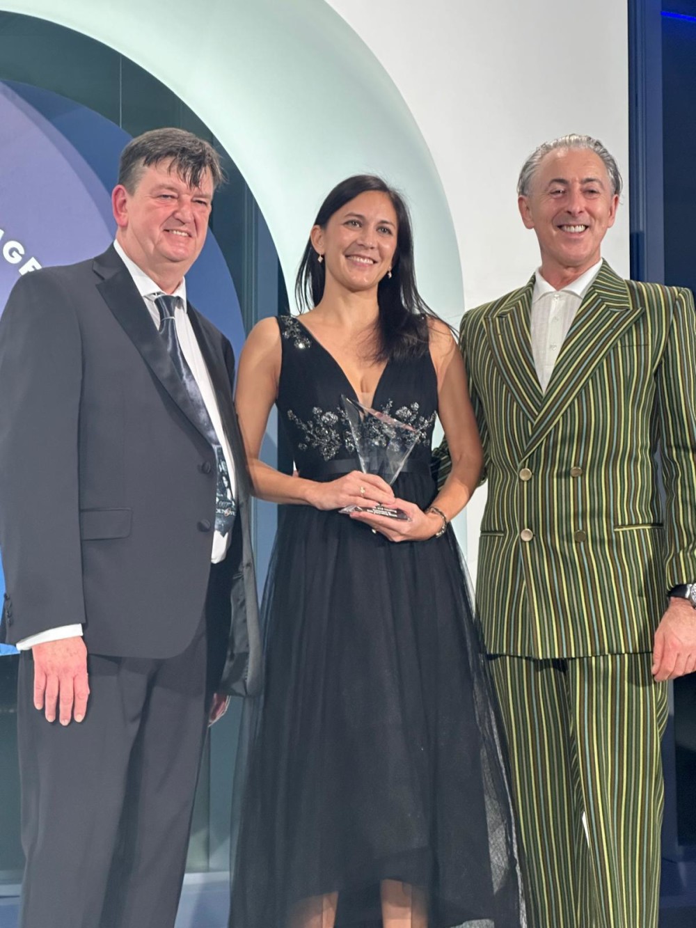 KidsOR Chief Medical Officer, Dr. Maija Cheung, is presented the award by the Public Interest Registry and Emmy-winning actor Alan Cumming.